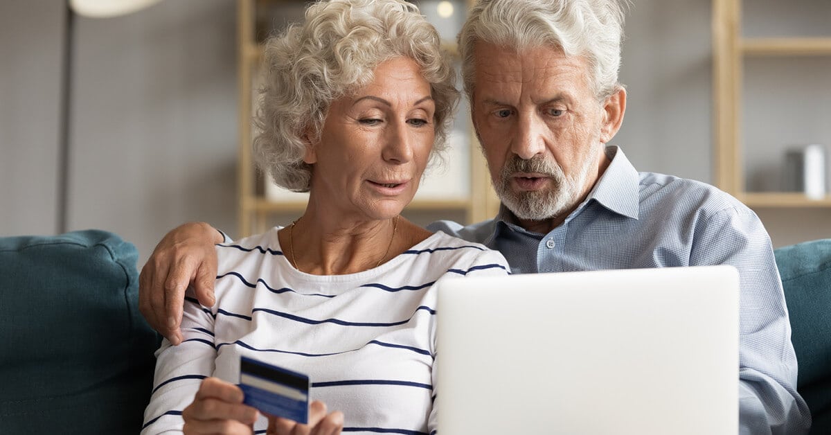 older couple looking at a laptop computer